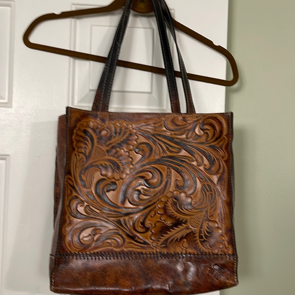 Brown leather Patricia Nash purse.